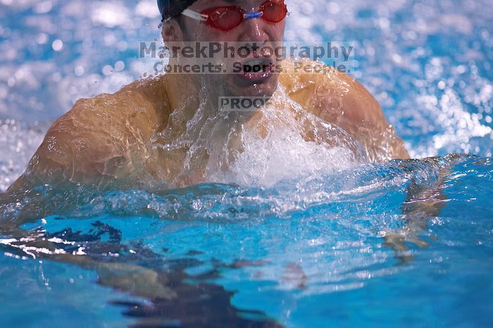 UT senior Matthew Lowe took first in the 200 yard breaststroke with a time of 2:01.46.  The University of Texas Longhorns defeated The University of Georgia Bulldogs 157-135 on Saturday, January 12, 2008.

Filename: SRM_20080112_1202086.jpg
Aperture: f/2.8
Shutter Speed: 1/400
Body: Canon EOS-1D Mark II
Lens: Canon EF 300mm f/2.8 L IS