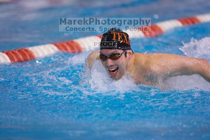 UT sophomore Trey Hoover competed in the 400 yard IM with a time of 4:10.06.  The University of Texas Longhorns defeated The University of Georgia Bulldogs 157-135 on Saturday, January 12, 2008.

Filename: SRM_20080112_1238046.jpg
Aperture: f/2.8
Shutter Speed: 1/400
Body: Canon EOS-1D Mark II
Lens: Canon EF 300mm f/2.8 L IS
