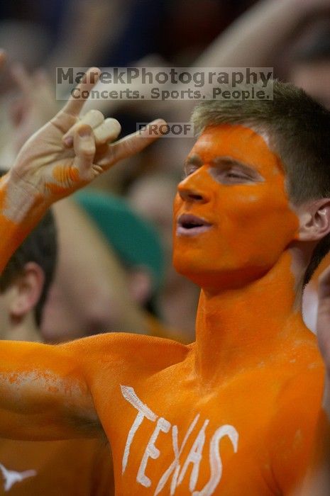 Dane Ehlert shows his school spirit before the Kansas basketball game.  The University of Texas (UT) Longhorns defeated the University of Kansas Jayhawks 72-69 in Austin, Texas on Monday, February 11, 2008.

Filename: SRM_20080211_1958244.jpg
Aperture: f/2.8
Shutter Speed: 1/640
Body: Canon EOS 20D
Lens: Canon EF 300mm f/2.8 L IS