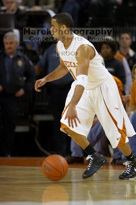 UT junior A.J. Abrams (#3, G) playing defense against a Kansas player.  The University of Texas (UT) Longhorns defeated the University of Kansas Jayhawks 72-69 in Austin, Texas on Monday, February 11, 2008.

Filename: SRM_20080211_2016164.jpg
Aperture: f/2.8
Shutter Speed: 1/640
Body: Canon EOS 20D
Lens: Canon EF 300mm f/2.8 L IS
