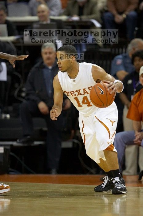 UT junior A.J. Abrams (#3, G) playing defense against a Kansas player.  The University of Texas (UT) Longhorns defeated the University of Kansas Jayhawks 72-69 in Austin, Texas on Monday, February 11, 2008.

Filename: SRM_20080211_2036321.jpg
Aperture: f/2.8
Shutter Speed: 1/640
Body: Canon EOS 20D
Lens: Canon EF 300mm f/2.8 L IS