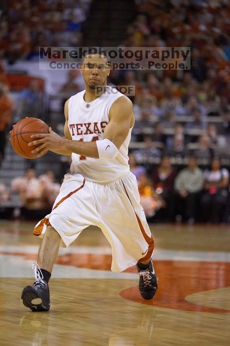 UT junior A.J. Abrams (#3, G) playing defense against a Kansas player.  The University of Texas (UT) Longhorns defeated the University of Kansas Jayhawks 72-69 in Austin, Texas on Monday, February 11, 2008.

Filename: SRM_20080211_2133169.jpg
Aperture: f/2.8
Shutter Speed: 1/640
Body: Canon EOS-1D Mark II
Lens: Canon EF 80-200mm f/2.8 L