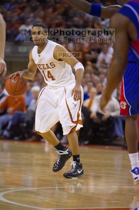 UT junior A.J. Abrams (#3, G) playing defense against a Kansas player.  The University of Texas (UT) Longhorns defeated the University of Kansas Jayhawks 72-69 in Austin, Texas on Monday, February 11, 2008.

Filename: SRM_20080211_2134124.jpg
Aperture: f/2.8
Shutter Speed: 1/640
Body: Canon EOS-1D Mark II
Lens: Canon EF 80-200mm f/2.8 L
