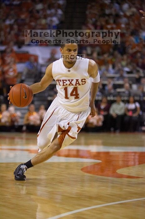 UT sophomore D.J. Augustin (#14, G) makes a drive.  The University of Texas (UT) Longhorns defeated the University of Kansas Jayhawks 72-69 in Austin, Texas on Monday, February 11, 2008.

Filename: SRM_20080211_2135044.jpg
Aperture: f/2.8
Shutter Speed: 1/640
Body: Canon EOS-1D Mark II
Lens: Canon EF 80-200mm f/2.8 L