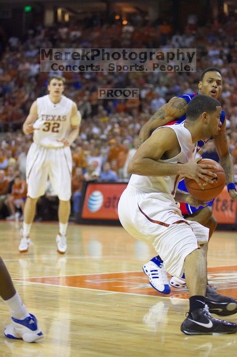 UT junior A.J. Abrams (#3, G) playing defense against a Kansas player.  The University of Texas (UT) Longhorns defeated the University of Kansas Jayhawks 72-69 in Austin, Texas on Monday, February 11, 2008.

Filename: SRM_20080211_2153266.jpg
Aperture: f/2.8
Shutter Speed: 1/640
Body: Canon EOS-1D Mark II
Lens: Canon EF 80-200mm f/2.8 L