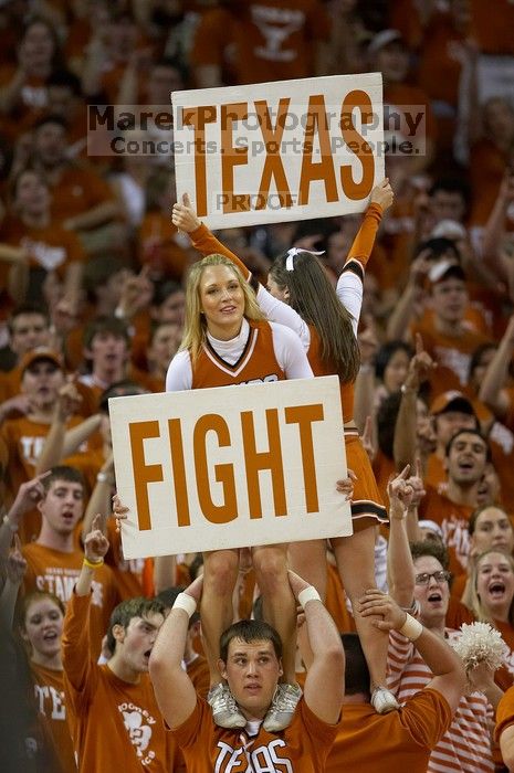 Cheerleaders.  The University of Texas (UT) Longhorns defeated the University of Kansas Jayhawks 72-69 in Austin, Texas on Monday, February 11, 2008.

Filename: SRM_20080211_2204148.jpg
Aperture: f/2.8
Shutter Speed: 1/640
Body: Canon EOS 20D
Lens: Canon EF 300mm f/2.8 L IS