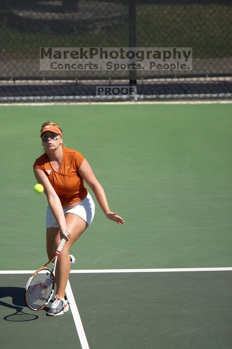 First doubles UT sophomore Vanja Corovic and UT junior Marija Milic defeated CSUS sophomore Aileen Tsan and CSUS junior Anastassia Lyssenko 8-3.  The University of Texas defeated Sacramento State on Saturday, March 22, 2008.

Filename: SRM_20080322_1114263.jpg
Aperture: f/4.0
Shutter Speed: 1/4000
Body: Canon EOS-1D Mark II
Lens: Canon EF 300mm f/2.8 L IS