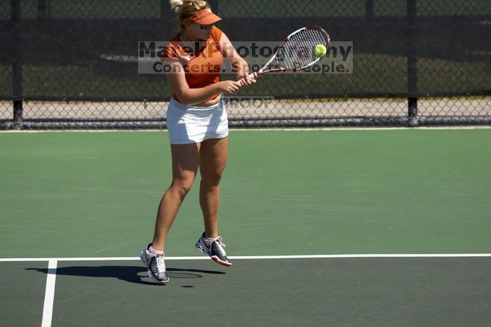 First doubles UT sophomore Vanja Corovic and UT junior Marija Milic defeated CSUS sophomore Aileen Tsan and CSUS junior Anastassia Lyssenko 8-3.  The University of Texas defeated Sacramento State on Saturday, March 22, 2008.

Filename: SRM_20080322_1122540.jpg
Aperture: f/4.0
Shutter Speed: 1/4000
Body: Canon EOS-1D Mark II
Lens: Canon EF 300mm f/2.8 L IS