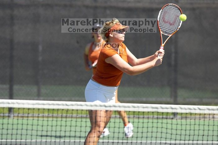 First doubles UT sophomore Vanja Corovic and UT junior Marija Milic defeated CSUS sophomore Aileen Tsan and CSUS junior Anastassia Lyssenko 8-3.  The University of Texas defeated Sacramento State on Saturday, March 22, 2008.

Filename: SRM_20080322_1155225.jpg
Aperture: f/4.0
Shutter Speed: 1/3200
Body: Canon EOS-1D Mark II
Lens: Canon EF 300mm f/2.8 L IS