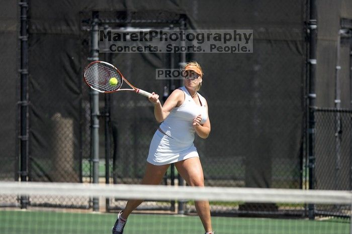 First singles UT sophomore Vanja Corovic defeated CSUS freshman Melissa Valenzuela 6-2, 6-0.  The University of Texas defeated Sacramento State on Saturday, March 22, 2008.

Filename: SRM_20080322_1236225.jpg
Aperture: f/2.8
Shutter Speed: 1/4000
Body: Canon EOS-1D Mark II
Lens: Canon EF 300mm f/2.8 L IS