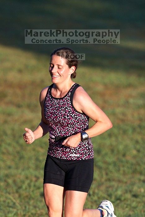 Beth Marek (bib #81) of Austin placed 4 in her age group (F 30-34) with an overall time of 01:46:51 at The Howdy Du duathlon in Berry Springs Park, Georgetown, Sunday July 6, 2008.

Filename: SRM_20080706_0731080.jpg
Aperture: f/4.0
Shutter Speed: 1/1250
Body: Canon EOS 20D
Lens: Canon EF 300mm f/2.8 L IS
