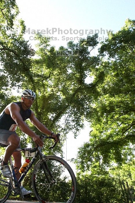 Louie Carmona (bib #61) of Austin placed 5 in his age group (M 30-34) with an overall time of 01:44:58 at The Howdy Du duathlon in Berry Springs Park, Georgetown, Sunday July 6, 2008.

Filename: SRM_20080706_0839143.jpg
Aperture: f/6.3
Shutter Speed: 1/1250
Body: Canon EOS 20D
Lens: Canon EF 16-35mm f/2.8 L