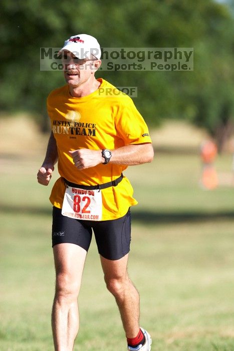 Tyson McGowan (bib #82) of Austin placed 7 in his age group (M 35-39) with an overall time of 01:44:00 at The Howdy Du duathlon in Berry Springs Park, Georgetown, Sunday July 6, 2008.

Filename: SRM_20080706_0853046.jpg
Aperture: f/4.0
Shutter Speed: 1/500
Body: Canon EOS 20D
Lens: Canon EF 300mm f/2.8 L IS