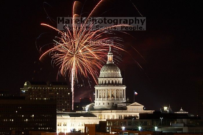 Austin Independence Day fireworks with the Capitol building, as viewed from atop the Manor Garage at The University of Texas at Austin.  The fireworks were launched from Auditorium Shores, downtown Austin, Friday, July 4, 2008.

Filename: SRM_20080704_2134526.jpg
Aperture: f/11.0
Shutter Speed: 10/1
Body: Canon EOS 20D
Lens: Canon EF 80-200mm f/2.8 L