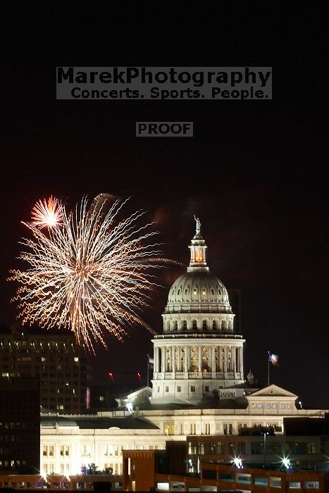 Austin Independence Day fireworks with the Capitol building, as viewed from atop the Manor Garage at The University of Texas at Austin.  The fireworks were launched from Auditorium Shores, downtown Austin, Friday, July 4, 2008.

Filename: SRM_20080704_2136368.jpg
Aperture: f/11.0
Shutter Speed: 10/1
Body: Canon EOS 20D
Lens: Canon EF 80-200mm f/2.8 L
