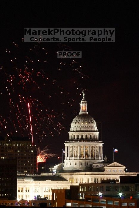 Austin Independence Day fireworks with the Capitol building, as viewed from atop the Manor Garage at The University of Texas at Austin.  The fireworks were launched from Auditorium Shores, downtown Austin, Friday, July 4, 2008.

Filename: SRM_20080704_2137480.jpg
Aperture: f/11.0
Shutter Speed: 10/1
Body: Canon EOS 20D
Lens: Canon EF 80-200mm f/2.8 L