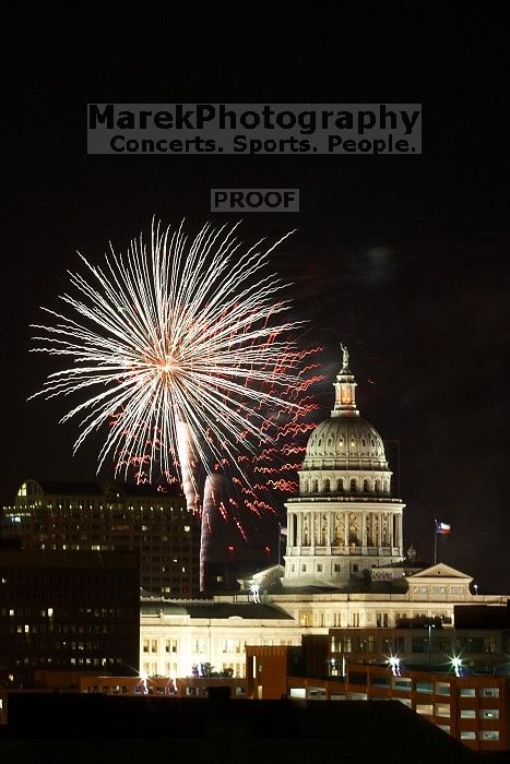 Austin Independence Day fireworks with the Capitol building, as viewed from atop the Manor Garage at The University of Texas at Austin.  The fireworks were launched from Auditorium Shores, downtown Austin, Friday, July 4, 2008.

Filename: SRM_20080704_2138382.jpg
Aperture: f/11.0
Shutter Speed: 10/1
Body: Canon EOS 20D
Lens: Canon EF 80-200mm f/2.8 L