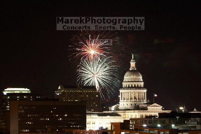 Austin Independence Day fireworks with the Capitol building, as viewed from atop the Manor Garage at The University of Texas at Austin.  The fireworks were launched from Auditorium Shores, downtown Austin, Friday, July 4, 2008.

Filename: SRM_20080704_2140149.jpg
Aperture: f/11.0
Shutter Speed: 6/1
Body: Canon EOS 20D
Lens: Canon EF 80-200mm f/2.8 L