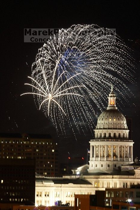 Austin Independence Day fireworks with the Capitol building, as viewed from atop the Manor Garage at The University of Texas at Austin.  The fireworks were launched from Auditorium Shores, downtown Austin, Friday, July 4, 2008.

Filename: SRM_20080704_2146343.jpg
Aperture: f/11.0
Shutter Speed: 5/1
Body: Canon EOS 20D
Lens: Canon EF 80-200mm f/2.8 L