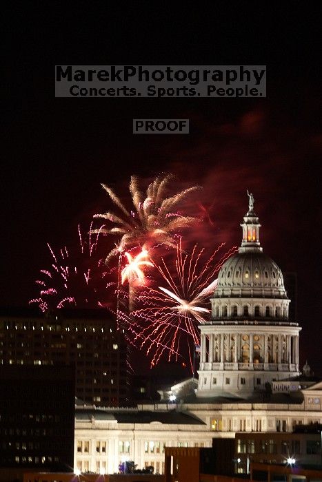 Austin Independence Day fireworks with the Capitol building, as viewed from atop the Manor Garage at The University of Texas at Austin.  The fireworks were launched from Auditorium Shores, downtown Austin, Friday, July 4, 2008.

Filename: SRM_20080704_2148463.jpg
Aperture: f/11.0
Shutter Speed: 2/1
Body: Canon EOS 20D
Lens: Canon EF 80-200mm f/2.8 L