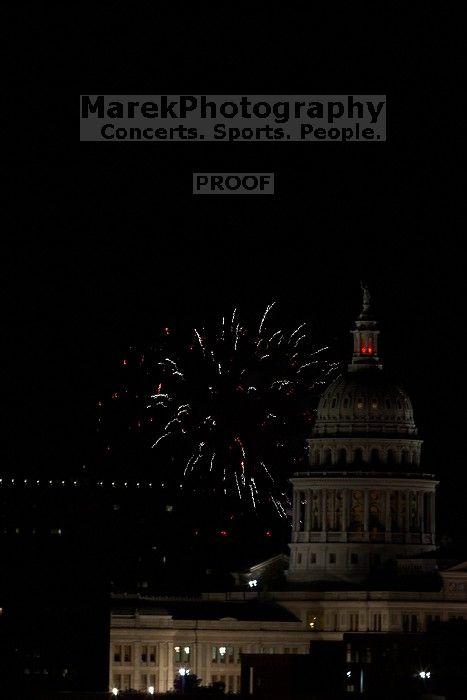 Austin Independence Day fireworks with the Capitol building, as viewed from atop the Manor Garage at The University of Texas at Austin.  The fireworks were launched from Auditorium Shores, downtown Austin, Friday, July 4, 2008.

Filename: SRM_20080704_2155301.jpg
Aperture: f/11.0
Shutter Speed: 1/1
Body: Canon EOS 20D
Lens: Canon EF 80-200mm f/2.8 L