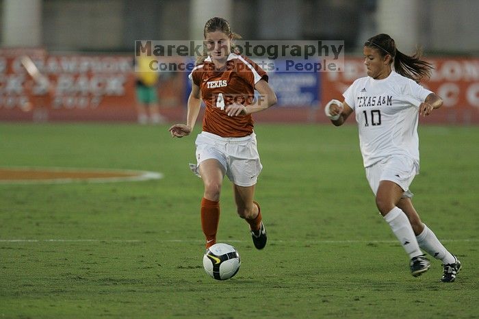 UT senior Jill Gilbeau (#4, Defender and Midfielder).  The University of Texas women's soccer team tied 0-0 against the Texas A&M Aggies Friday night, September 27, 2008.

Filename: SRM_20080926_1922226.jpg
Aperture: f/4.0
Shutter Speed: 1/500
Body: Canon EOS-1D Mark II
Lens: Canon EF 300mm f/2.8 L IS