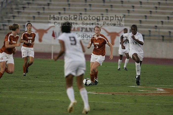 UT freshman Courtney Goodson (#7, Forward and Midfielder).  The University of Texas women's soccer team tied 0-0 against the Texas A&M Aggies Friday night, September 27, 2008.

Filename: SRM_20080926_1924205.jpg
Aperture: f/4.0
Shutter Speed: 1/640
Body: Canon EOS-1D Mark II
Lens: Canon EF 300mm f/2.8 L IS