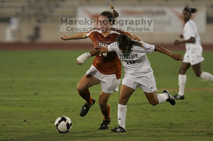 UT senior Kasey Moore (#14, Defender) brings the ball downfield.  The University of Texas women's soccer team tied 0-0 against the Texas A&M Aggies Friday night, September 27, 2008.

Filename: SRM_20080926_1935427.jpg
Aperture: f/4.0
Shutter Speed: 1/500
Body: Canon EOS-1D Mark II
Lens: Canon EF 300mm f/2.8 L IS