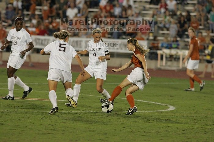 UT senior Jill Gilbeau (#4, Defender and Midfielder).  The University of Texas women's soccer team tied 0-0 against the Texas A&M Aggies Friday night, September 27, 2008.

Filename: SRM_20080926_2019585.jpg
Aperture: f/4.0
Shutter Speed: 1/400
Body: Canon EOS-1D Mark II
Lens: Canon EF 300mm f/2.8 L IS