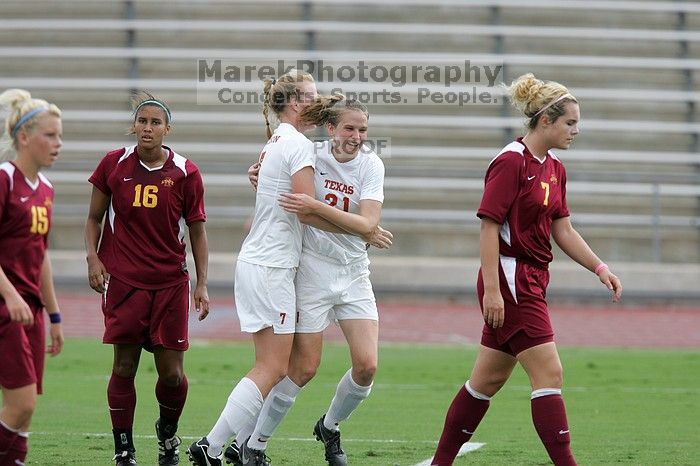 UT freshman Courtney Goodson (#7, Forward and Midfielder) congratulates UT junior Emily Anderson (#21, Forward) after her goal in the first half.  The University of Texas women's soccer team won 2-1 against the Iowa State Cyclones Sunday afternoon, October 5, 2008.

Filename: SRM_20081005_12210695.jpg
Aperture: f/5.0
Shutter Speed: 1/1600
Body: Canon EOS-1D Mark II
Lens: Canon EF 300mm f/2.8 L IS