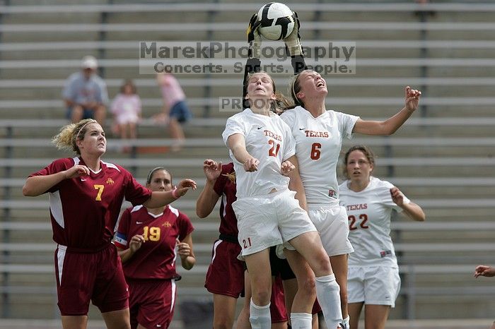 UT junior Emily Anderson (#21, Forward) and UT freshman Lucy Keith (#6, Midfielder) fight for the header with the keeper, as UT junior Stephanie Gibson (#22, Defense and Forward) watches.  The University of Texas women's soccer team won 2-1 against the Iowa State Cyclones Sunday afternoon, October 5, 2008.

Filename: SRM_20081005_12420622.jpg
Aperture: f/5.6
Shutter Speed: 1/2000
Body: Canon EOS-1D Mark II
Lens: Canon EF 300mm f/2.8 L IS