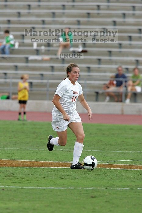 UT senior Kasey Moore (#14, Defender) takes the ball upfield in the second half.  The University of Texas women's soccer team won 2-1 against the Iowa State Cyclones Sunday afternoon, October 5, 2008.

Filename: SRM_20081005_13174858.jpg
Aperture: f/5.6
Shutter Speed: 1/1250
Body: Canon EOS-1D Mark II
Lens: Canon EF 300mm f/2.8 L IS