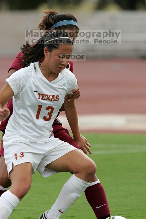 UT freshman Amanda Lisberger (#13, Midfielder) in the second half.  The University of Texas women's soccer team won 2-1 against the Iowa State Cyclones Sunday afternoon, October 5, 2008.

Filename: SRM_20081005_13310823.jpg
Aperture: f/5.6
Shutter Speed: 1/1250
Body: Canon EOS-1D Mark II
Lens: Canon EF 300mm f/2.8 L IS