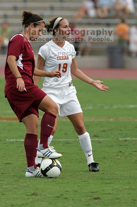 UT sophomore Erica Campanelli (#19, Defender) argues with a referee about a foul in the second half.  The University of Texas women's soccer team won 2-1 against the Iowa State Cyclones Sunday afternoon, October 5, 2008.

Filename: SRM_20081005_13312029.jpg
Aperture: f/5.6
Shutter Speed: 1/1600
Body: Canon EOS-1D Mark II
Lens: Canon EF 300mm f/2.8 L IS