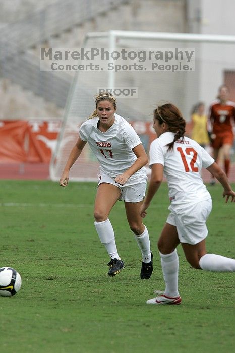 UT sophomore Kate Nicholson (#17, Forward and Midfielder) and UT sophomore Alisha Ortiz (#12, Forward) in the second half.  The University of Texas women's soccer team won 2-1 against the Iowa State Cyclones Sunday afternoon, October 5, 2008.

Filename: SRM_20081005_13325850.jpg
Aperture: f/5.6
Shutter Speed: 1/1600
Body: Canon EOS-1D Mark II
Lens: Canon EF 300mm f/2.8 L IS
