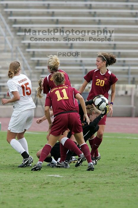 UT freshman Kylie Doniak (#15, Midfielder) and UT sophomore Kate Nicholson (#17, Forward and Midfielder) try for the header but the Iowa State goalkeeper gets to it first in the second half. The University of Texas women's soccer team won 2-1 against the Iowa State Cyclones Sunday afternoon, October 5, 2008.
Filename: SRM_20081005_13403245.jpg
Aperture: f/5.6
Shutter Speed: 1/1250
Body: Canon EOS-1D Mark II
Lens: Canon EF 300mm f/2.8 L IS