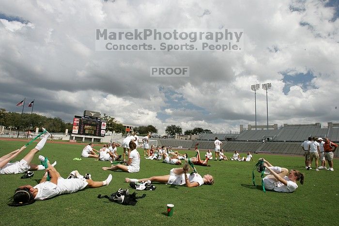 The team stretches after the match.  The University of Texas women's soccer team won 2-1 against the Iowa State Cyclones Sunday afternoon, October 5, 2008.

Filename: SRM_20081005_13531850.jpg
Aperture: f/11.0
Shutter Speed: 1/250
Body: Canon EOS-1D Mark II
Lens: Canon EF 16-35mm f/2.8 L