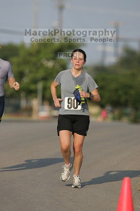 Beth Marek won first place in her age division at the Army Dillo half-marathon and 32K race.
Filename: SRM_20080921_0841361.jpg
Aperture: f/4.0
Shutter Speed: 1/2000
Body: Canon EOS-1D Mark II
Lens: Canon EF 300mm f/2.8 L IS