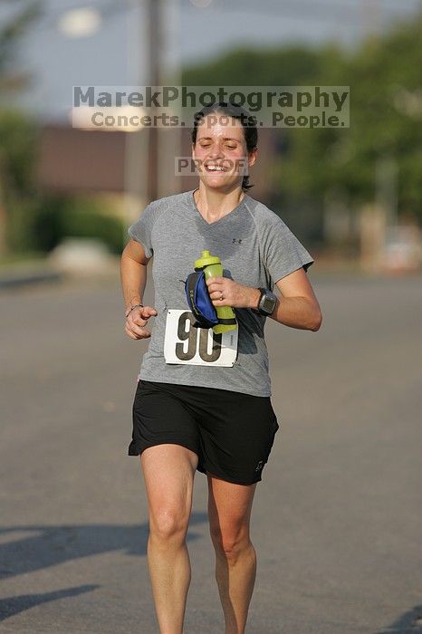 Beth Marek won first place in her age division at the Army Dillo half-marathon and 32K race.

Filename: SRM_20080921_0841388.jpg
Aperture: f/4.0
Shutter Speed: 1/2000
Body: Canon EOS-1D Mark II
Lens: Canon EF 300mm f/2.8 L IS