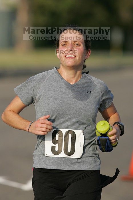 Beth Marek won first place in her age division at the Army Dillo half-marathon and 32K race.

Filename: SRM_20080921_0841421.jpg
Aperture: f/4.0
Shutter Speed: 1/2000
Body: Canon EOS-1D Mark II
Lens: Canon EF 300mm f/2.8 L IS