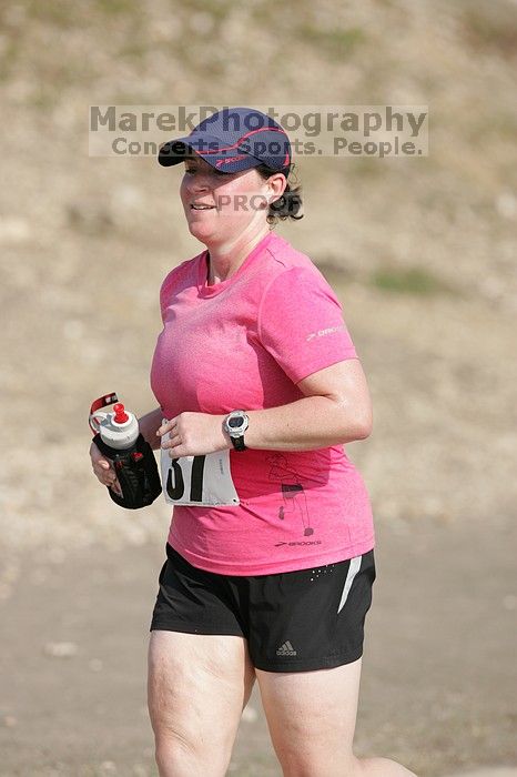 Meredith Cohen running the Army Dillo half-marathon and 32K race.

Filename: SRM_20080921_1001041.jpg
Aperture: f/4.0
Shutter Speed: 1/2000
Body: Canon EOS-1D Mark II
Lens: Canon EF 300mm f/2.8 L IS