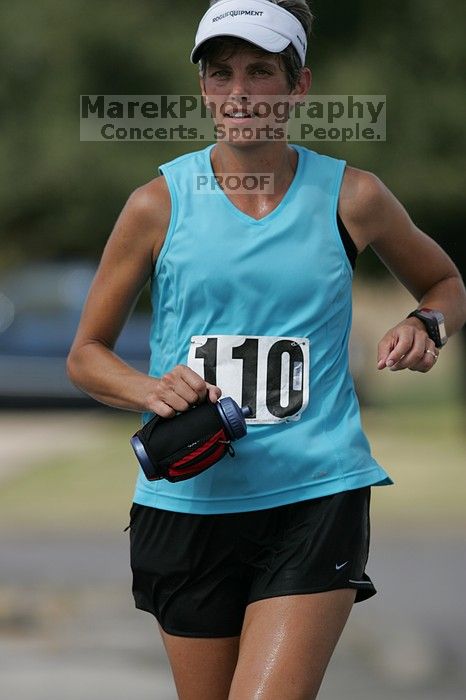 Karen Pearce placed second in her age groun at the Army Dillo half-marathon and 32K race.

Filename: SRM_20080921_1056460.jpg
Aperture: f/4.0
Shutter Speed: 1/2500
Body: Canon EOS-1D Mark II
Lens: Canon EF 300mm f/2.8 L IS