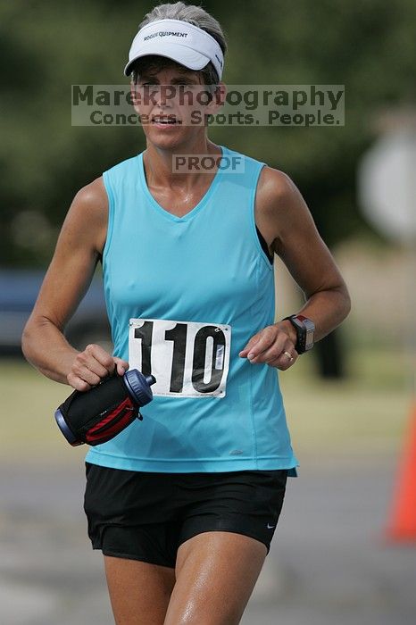 Karen Pearce placed second in her age groun at the Army Dillo half-marathon and 32K race.
Filename: SRM_20080921_1056469.jpg
Aperture: f/4.0
Shutter Speed: 1/2000
Body: Canon EOS-1D Mark II
Lens: Canon EF 300mm f/2.8 L IS