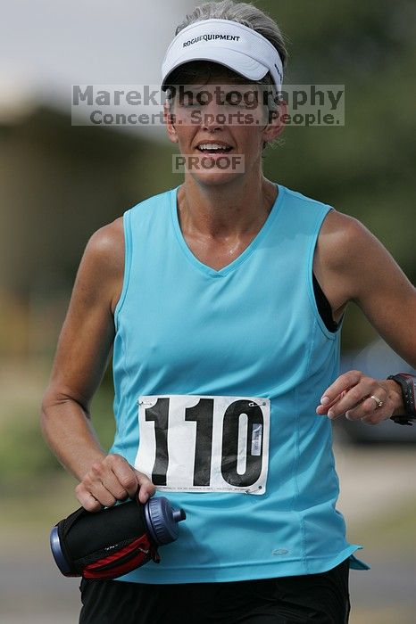 Karen Pearce placed second in her age groun at the Army Dillo half-marathon and 32K race.

Filename: SRM_20080921_1056484.jpg
Aperture: f/4.0
Shutter Speed: 1/2500
Body: Canon EOS-1D Mark II
Lens: Canon EF 300mm f/2.8 L IS