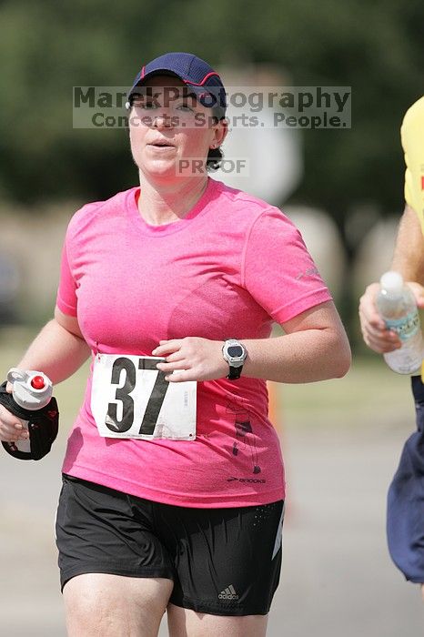 Meredith Cohen running the Army Dillo half-marathon and 32K race.

Filename: SRM_20080921_1116002.jpg
Aperture: f/4.0
Shutter Speed: 1/2000
Body: Canon EOS-1D Mark II
Lens: Canon EF 300mm f/2.8 L IS