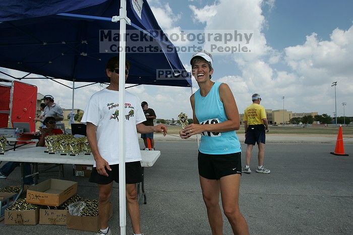 Karen Pearce placed second in her age groun at the Army Dillo half-marathon and 32K race.

Filename: SRM_20080921_1159280.jpg
Aperture: f/5.6
Shutter Speed: 1/200
Body: Canon EOS-1D Mark II
Lens: Canon EF 16-35mm f/2.8 L