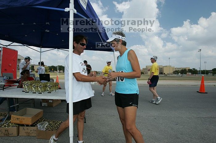 Karen Pearce placed second in her age groun at the Army Dillo half-marathon and 32K race.

Filename: SRM_20080921_1159289.jpg
Aperture: f/5.6
Shutter Speed: 1/160
Body: Canon EOS-1D Mark II
Lens: Canon EF 16-35mm f/2.8 L