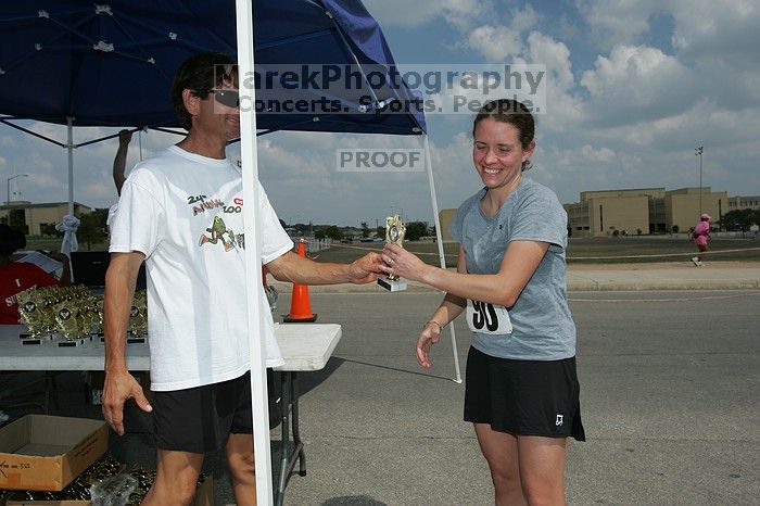 Beth Marek won first place in her age division at the Army Dillo half-marathon and 32K race.

Filename: SRM_20080921_1202082.jpg
Aperture: f/10.0
Shutter Speed: 1/250
Body: Canon EOS-1D Mark II
Lens: Canon EF 16-35mm f/2.8 L