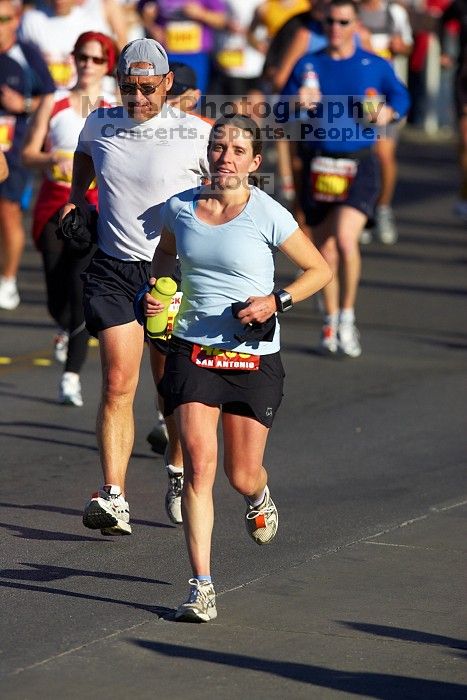 Beth Marek, bib #4236, completed the course in 3:38:21, a Boston Marathon qualifying time.  The first annual San Antonio Rock and Roll Marathon, Sunday, November 16, 2008.

Filename: SRM_20081116_08520013.jpg
Aperture: f/4.0
Shutter Speed: 1/3200
Body: Canon EOS-1D Mark II
Lens: Canon EF 300mm f/2.8 L IS