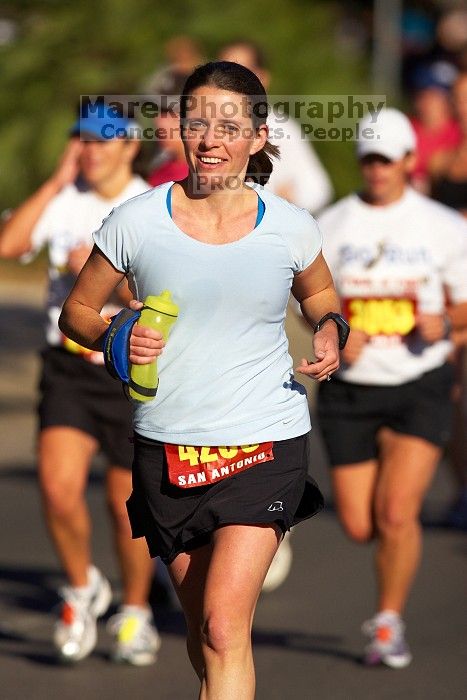 Beth Marek, bib #4236, completed the course in 3:38:21, a Boston Marathon qualifying time.  The first annual San Antonio Rock and Roll Marathon, Sunday, November 16, 2008.

Filename: SRM_20081116_09063840.jpg
Aperture: f/4.0
Shutter Speed: 1/4000
Body: Canon EOS-1D Mark II
Lens: Canon EF 300mm f/2.8 L IS